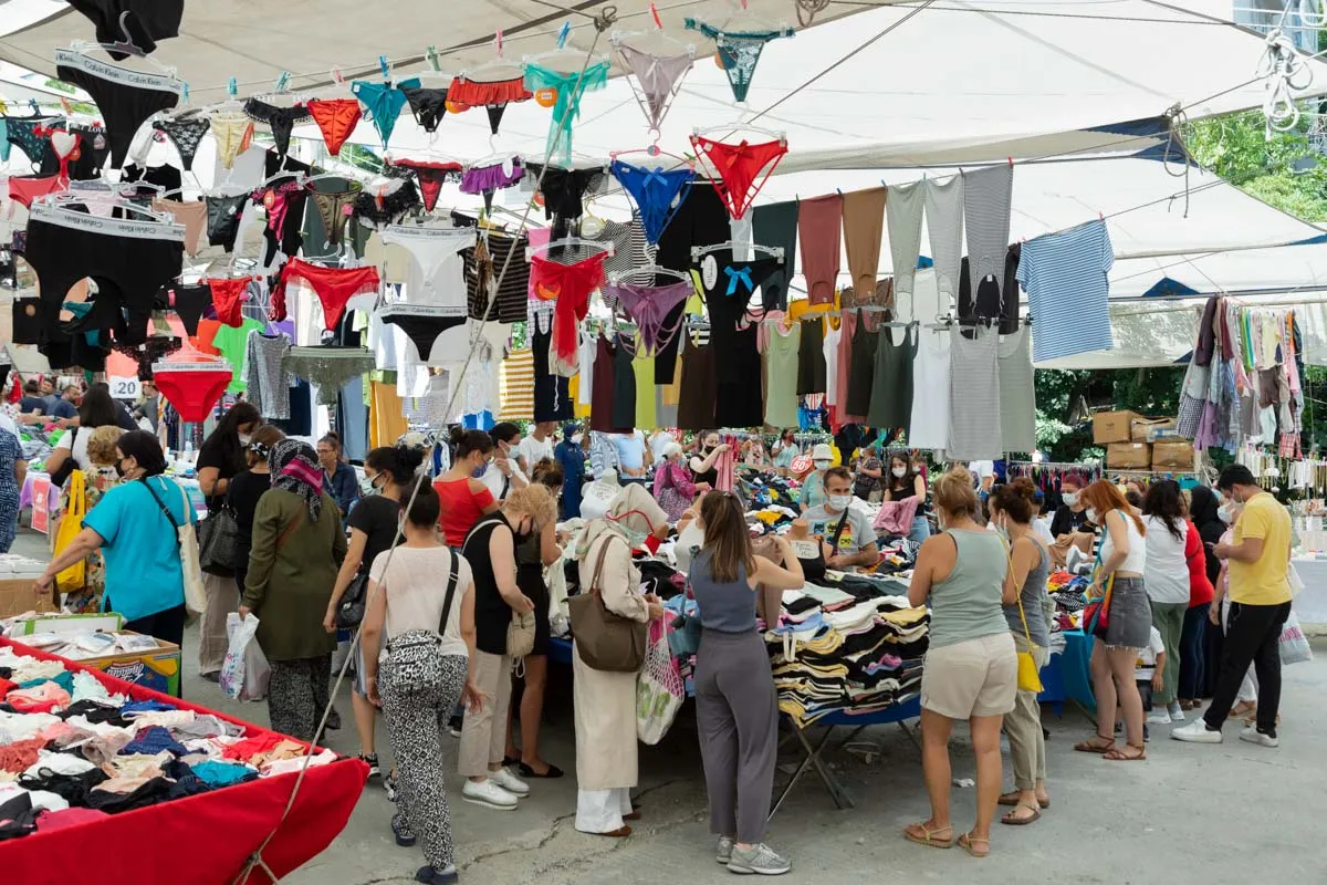 Clothing stalls under awnings at the Beşiktaş Saturday market, Istanbul