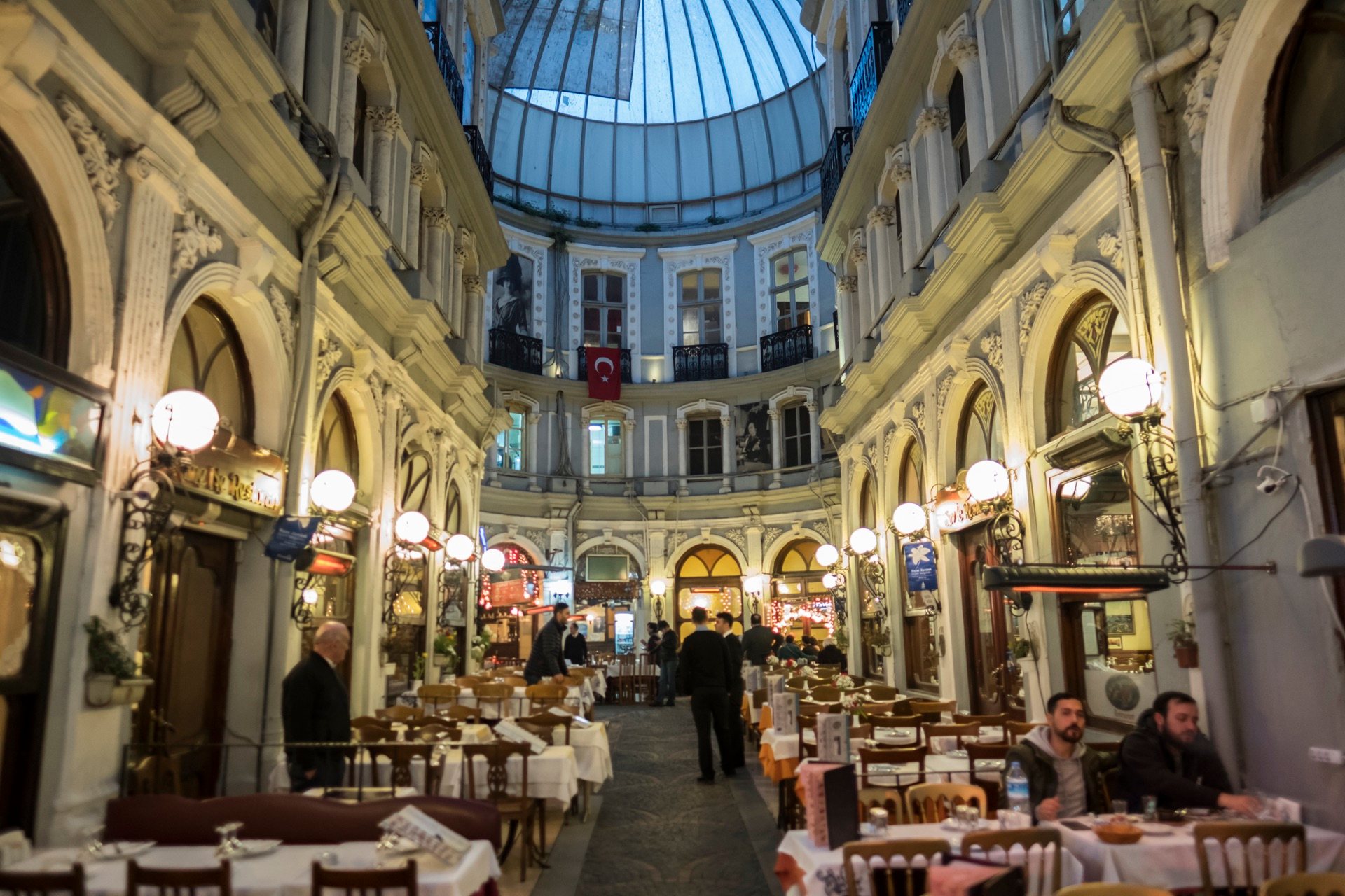 Çiçek Pasajı, the glass-domed arcade off İstiklâl, lined with restaurant tables in Istanbul
