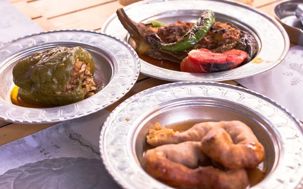 Homemade dishes of Çiya restaurant in traditional metal serving plates, taste of two continents food tour