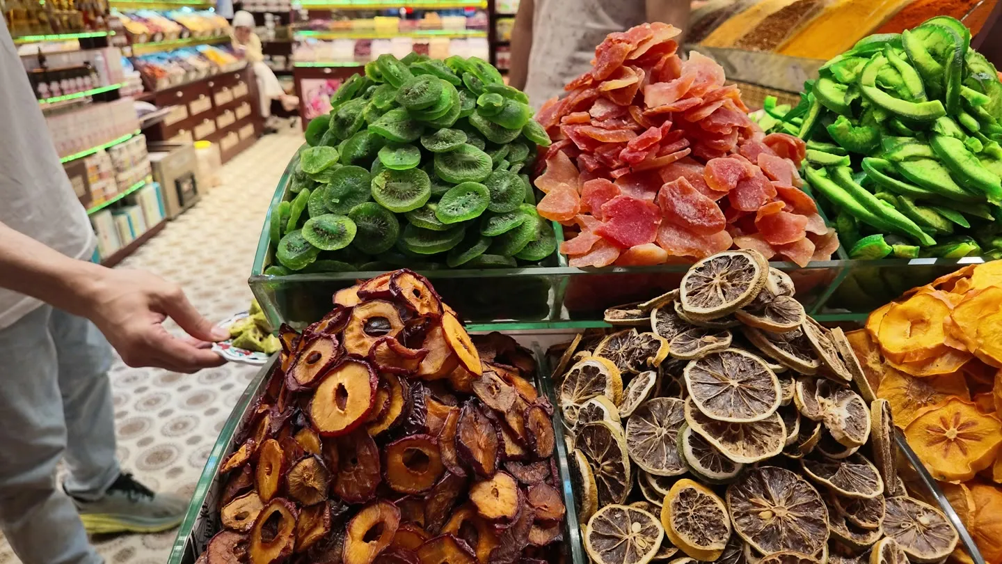 mounds of dried kiwi, mango, citrus slices, plums and persimmon at an Istanbul dried-fruit counter