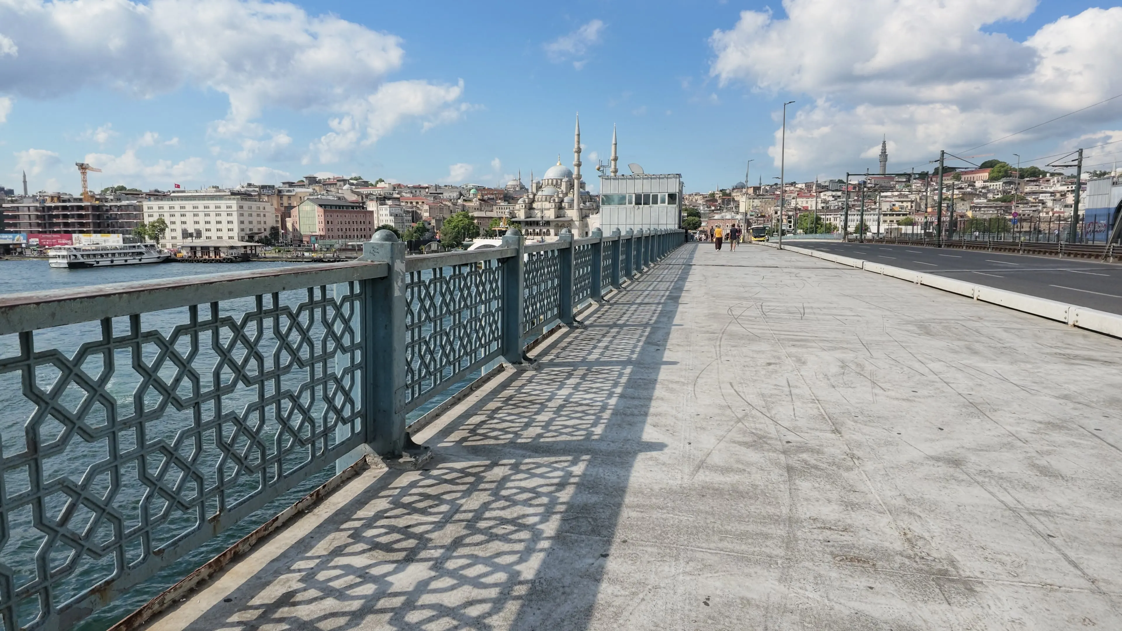 The pedestrian walkway on Galata Bridge looks toward Eminönü and the New Mosque