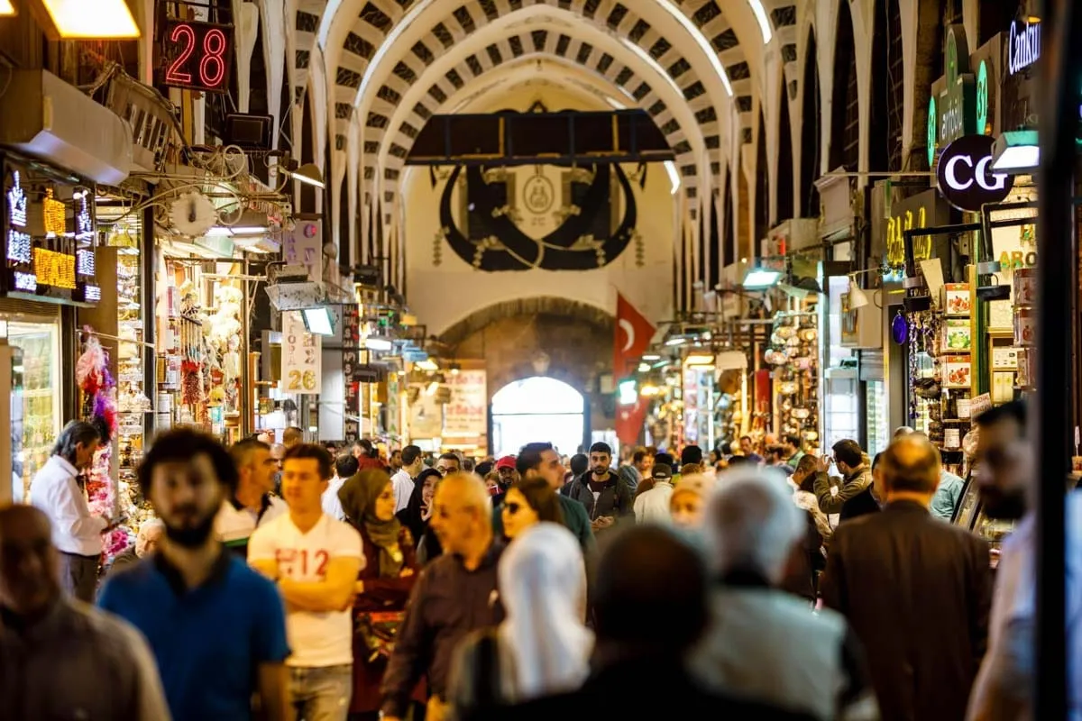 Crowds and shopfronts in the covered lanes of the Grand Bazaar, Istanbul