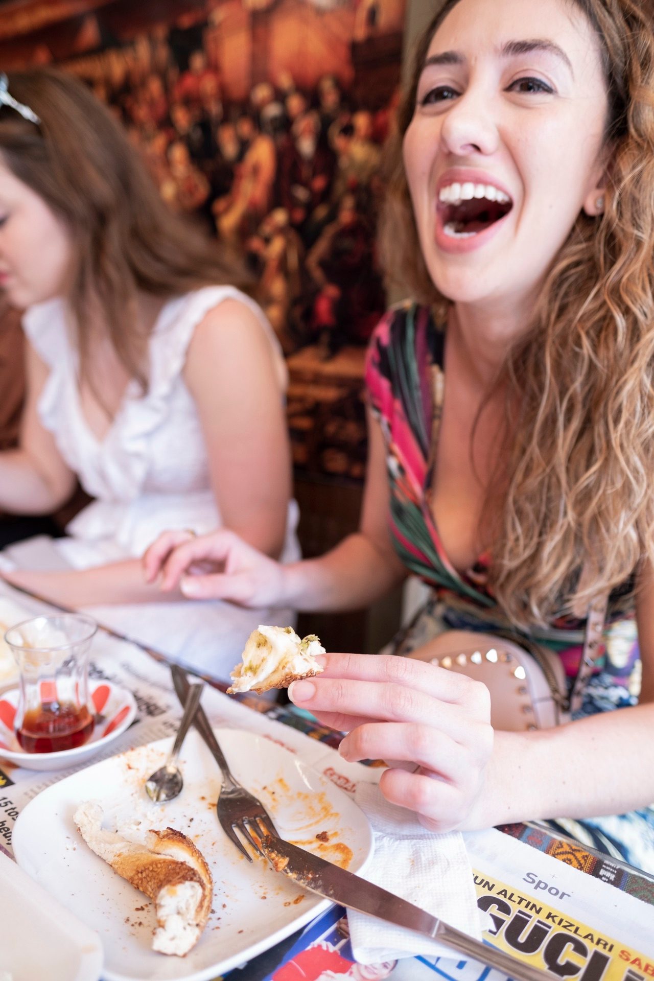guest laughing eating kaymak bread breakfast