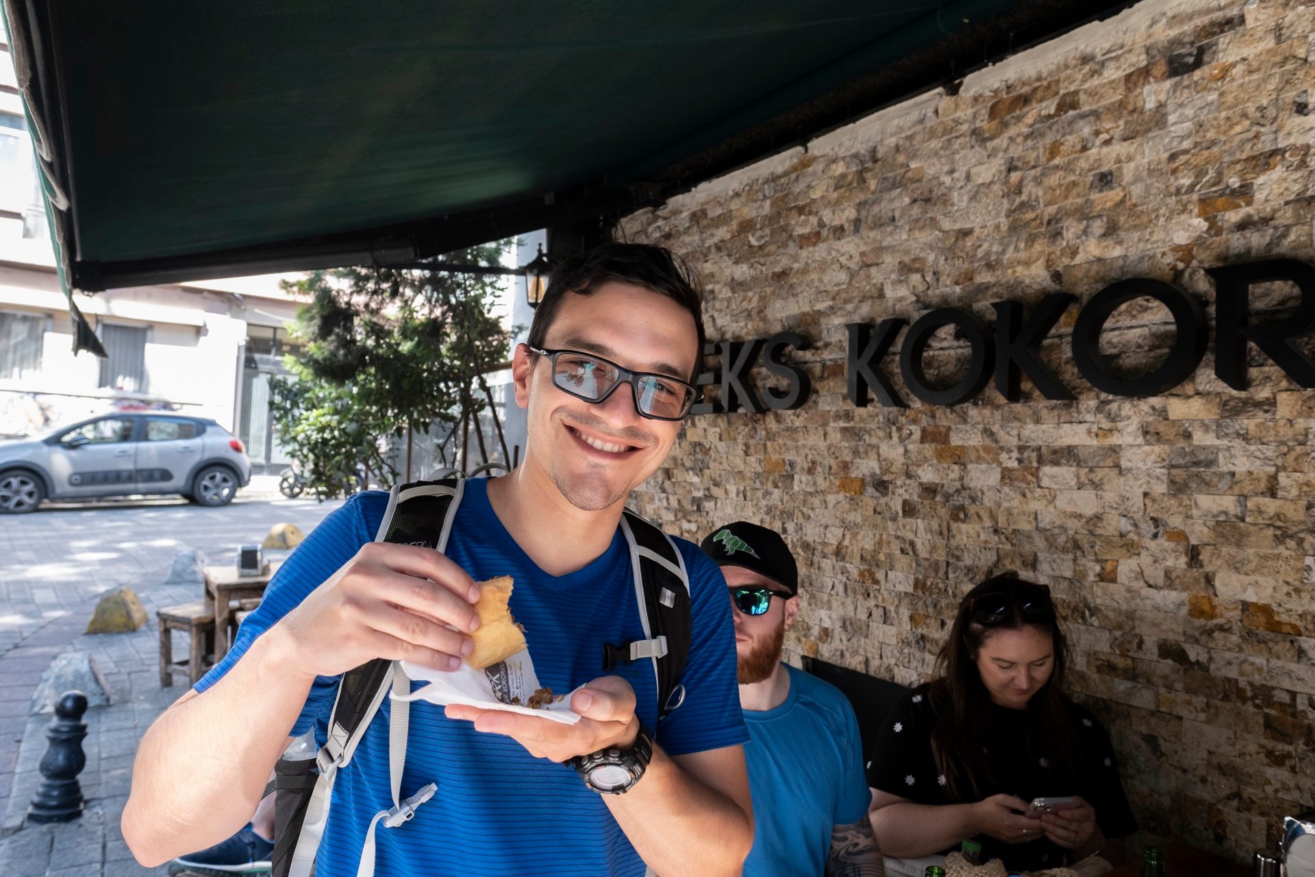 guest smiling kokorec sandwich istanbul street food