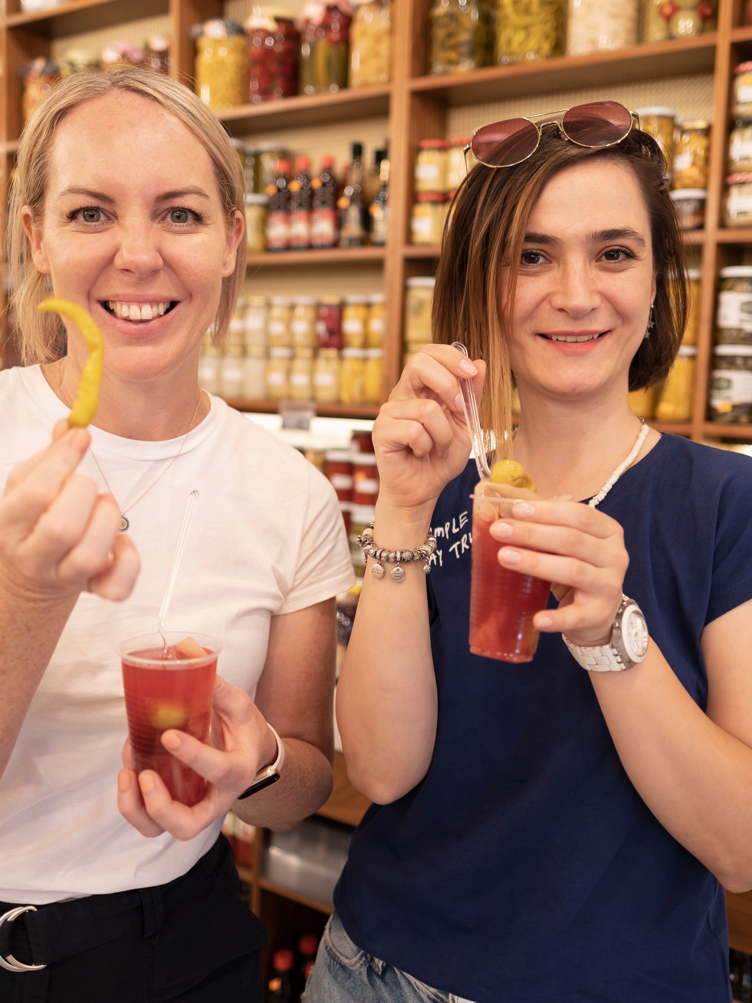 guide guest holding pickle juice shop istanbul mobile
