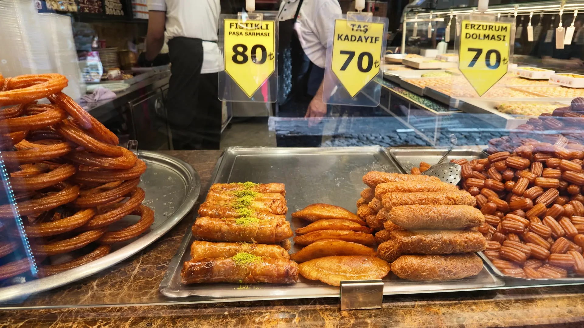 trays of tulumba, halka tatlisi and syrup-soaked pastries at an Istanbul dessert counter