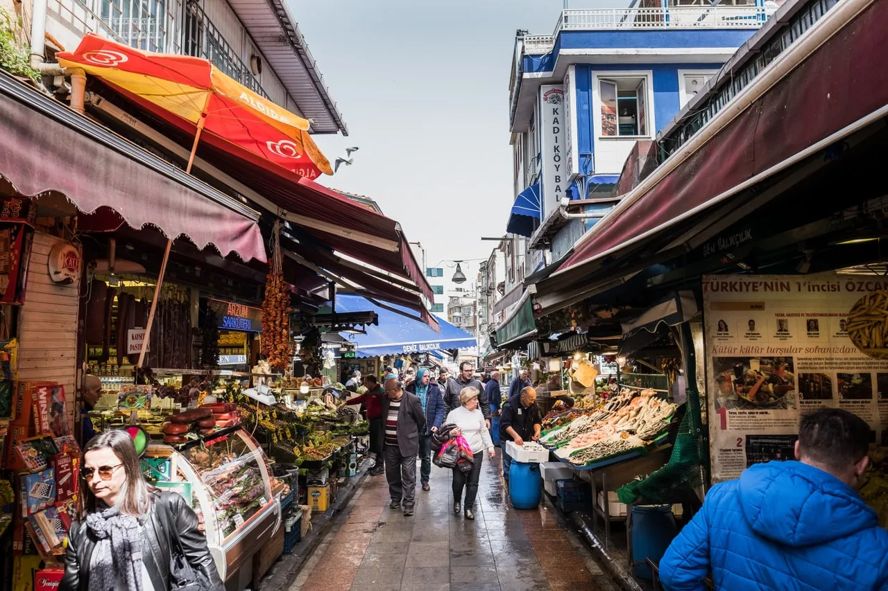 Busy fruit and vegetable stalls in the Kadıköy market streets, Istanbul