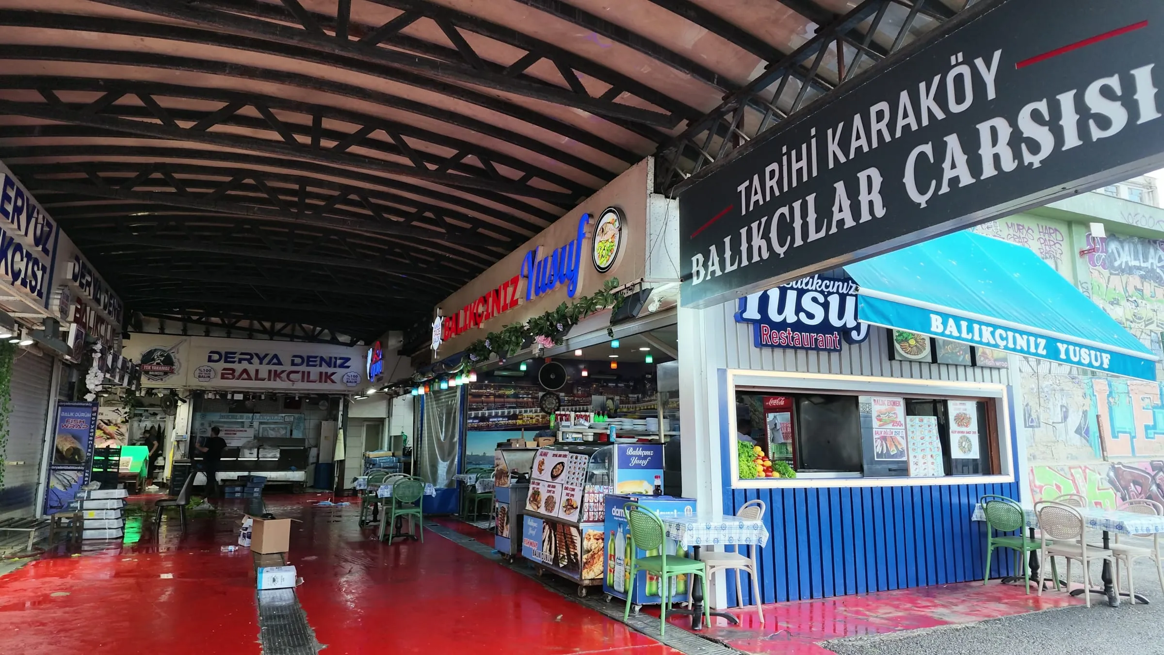 Fishmongers and seafood restaurants inside the covered Tarihi Karaköy Balıkçılar Çarşısı passage