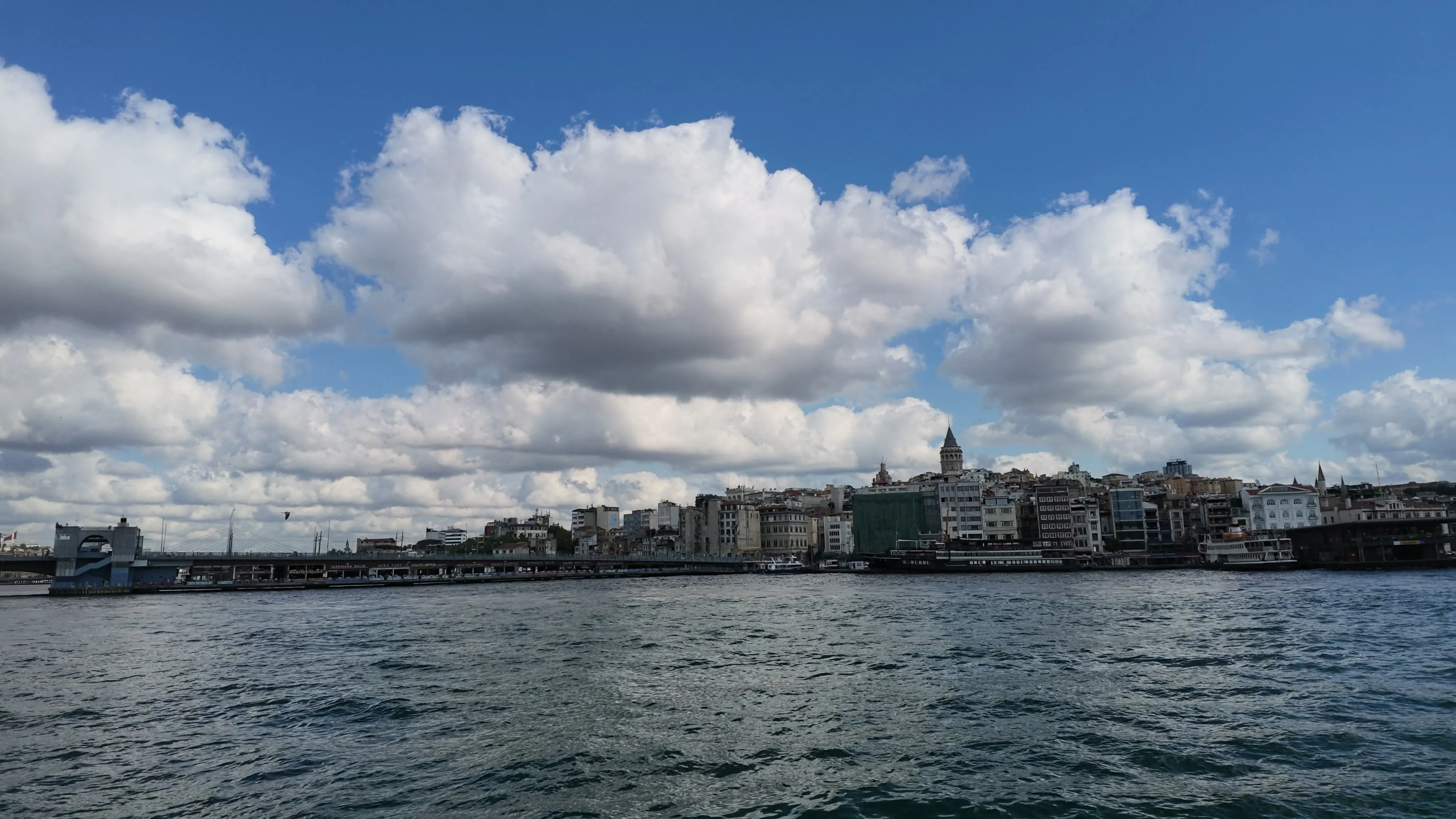 Karaköy's waterfront buildings sit below Galata Tower across the Golden Horn