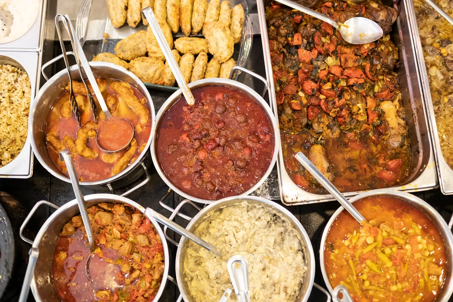 Steam trays of stews, köfte and vegetables at a lokanta counter