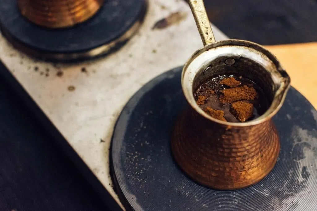 Turkish coffee cooking in a copper cezve
