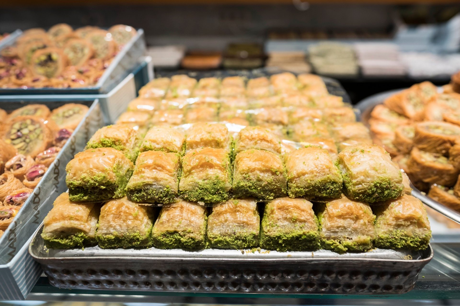 Trays of pistachio baklava in a bakery display case in Istanbul