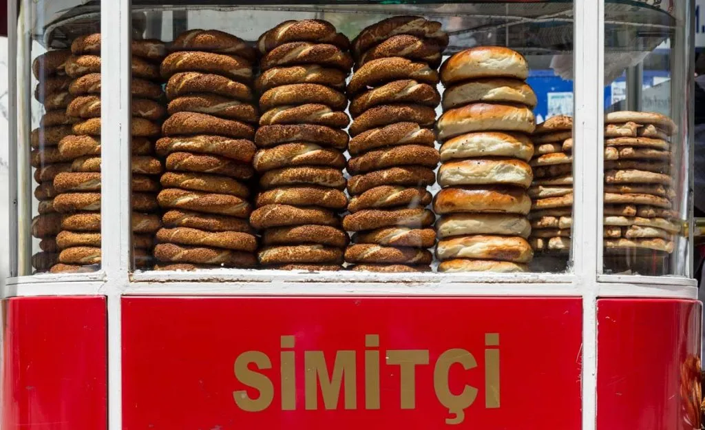 simit, acma and catal for sale on a street cart in istanbul