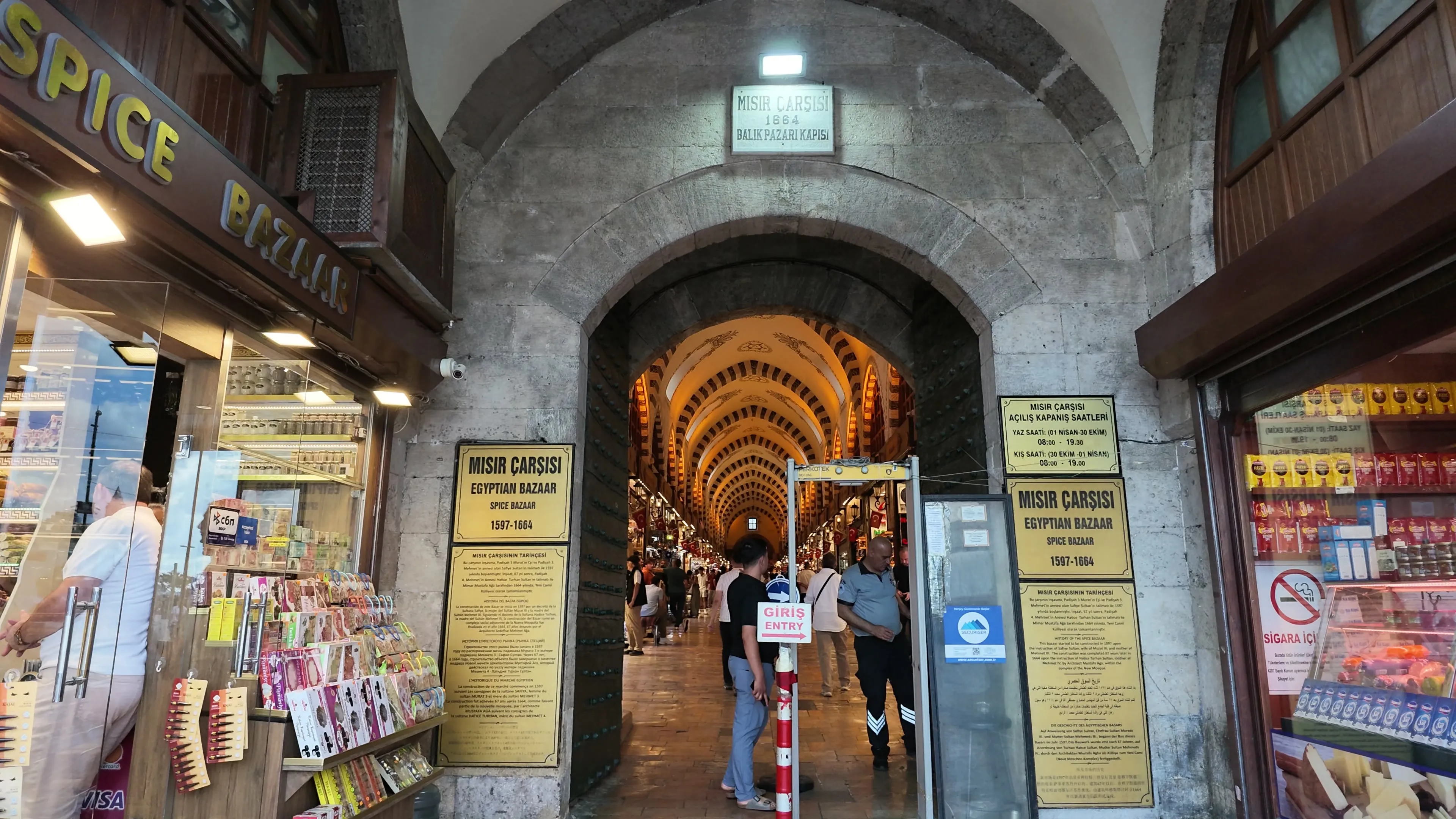 The stone entrance to the Spice Bazaar opens onto a brightly lit vaulted passage
